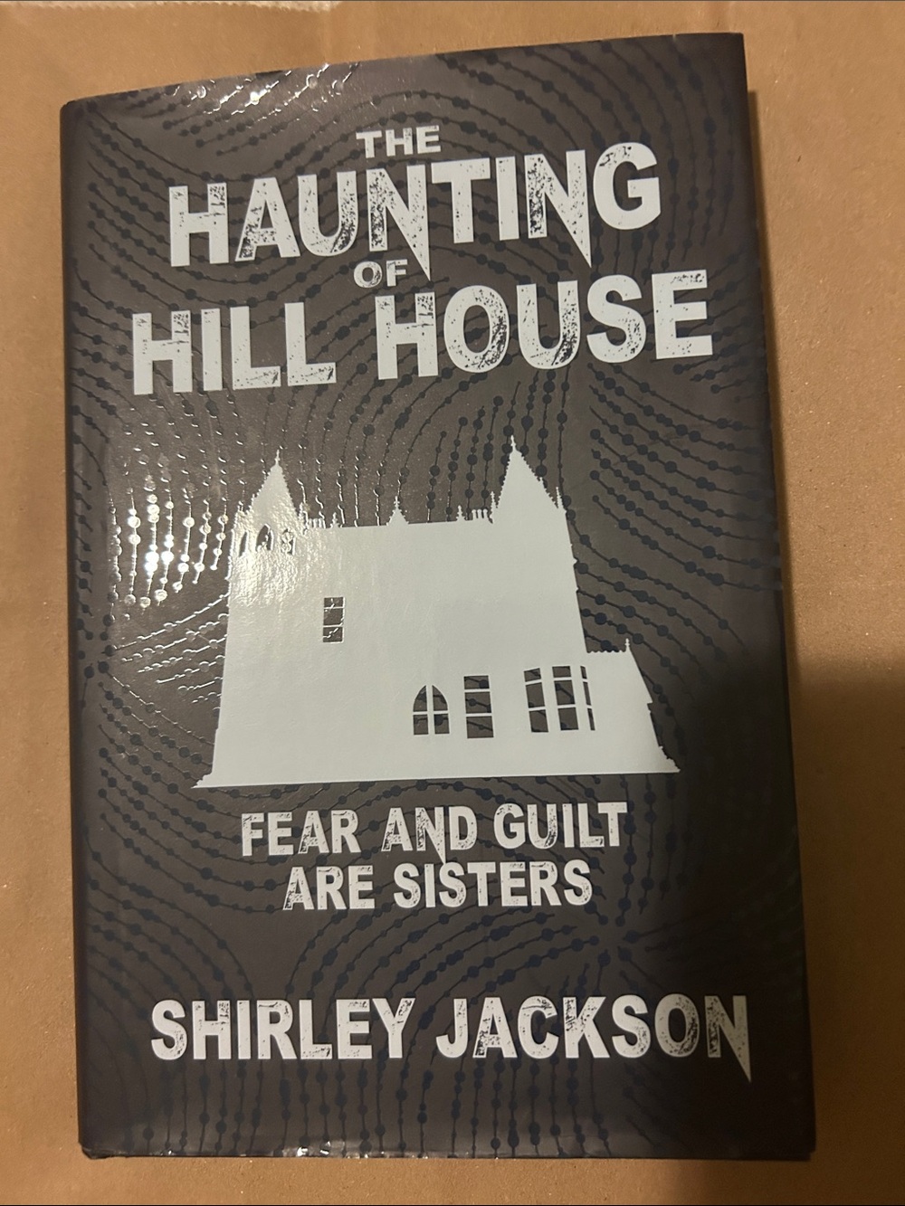 The Haunting of Hill House by Shirley Jackson - Grey & White Hardcover